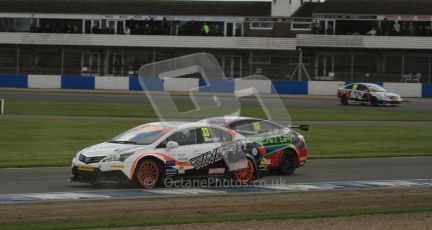 © Octane Photographic Ltd. BTCC - Round Two - Donington Park - Race 2. Sunday 15th April 2012. Adam Morgan and Andy Neate side by side through Hollywood. Digital ref : 0296lw7d4800