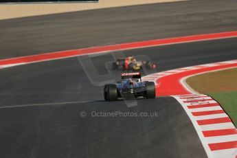 World © Octane Photographic Ltd. F1 USA - Circuit of the Americas - Friday Morning Practice - FP1. 16th November 2012. Jean-Eric Vergne's Toro Rosso STR7 chases the Lotus E20 of Kimi Raikkonen. Digital Ref: 0557lw1d0718