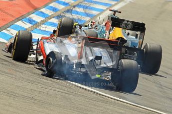 © 2012 Octane Photographic Ltd. German GP Hockenheim - Sunday 22nd July 2012 - F1 Race. McLaren MP4/27 - Lewis Hamilton with a shredded rear left is passed by the Caterham of Heikki Kovalainen. Digital Ref : 0423lw1d4971