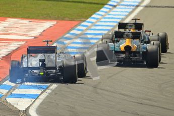© 2012 Octane Photographic Ltd. German GP Hockenheim - Sunday 22nd July 2012 - F1 Race. McLaren MP4/27 - Lewis Hamilton with a shredded rear left is passed by the Caterhams of Heikki Kovalainen and Vitaly Petrov. Digital Ref : 0423lw1d4977