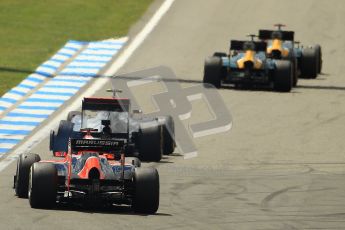 © 2012 Octane Photographic Ltd. German GP Hockenheim - Sunday 22nd July 2012 - F1 Race. McLaren MP4/27 - Lewis Hamilton with a shredded rear left is passed by the Caterhams of Heikki Kovalainen and Vitaly Petrov as Charles Pic lines up his move as well. Digital Ref : 0423lw1d4979