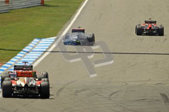 © 2012 Octane Photographic Ltd. German GP Hockenheim - Sunday 22nd July 2012 - F1 Race. McLaren MP4/27 - Lewis Hamilton with a shredded rear left is passed by Charles Pic's Marussia (who sensibly gives him a wide berth) as the battling Glock and Karthikeyan close in as well. Digital Ref : 0423lw1d4984