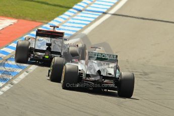 © 2012 Octane Photographic Ltd. German GP Hockenheim - Sunday 22nd July 2012 - F1 Race. McLaren MP4/27 - Jenson Button overtakes Michael Schumacher's Mercedes. Digital Ref : 0423lw1d5332