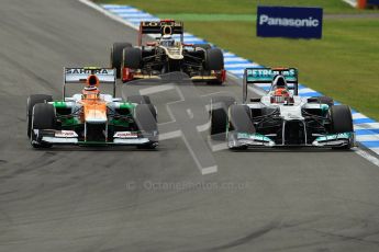 © 2012 Octane Photographic Ltd. German GP Hockenheim - Sunday 22nd July 2012 - F1 Race. Force India VJM05 - Nico Hulkenberg and the Mercedes W03 of Michael Schumacher side by side into the hairpin. Digital Ref : 0423lw1d5429