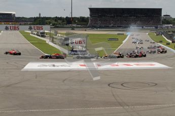 © 2012 Octane Photographic Ltd. German GP Hockenheim - Sunday 22nd July 2012 - F1 Race. The pack heads around the hairpin on the opening lap. Digital Ref : 0423lw7d8566