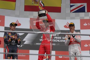 © 2012 Octane Photographic Ltd. German GP Hockenheim - Sunday 22nd July 2012 - F1 Podium - Fernando Alonso - Winner (Ferrari) alongside Sebastian Vettel, 2nd (Red Bull), and Jenson Button 3rd. Vettel was later dropped to 5th with a penalty for overtaking Button (McLaren) off the track in the final laps. Digital Ref : 0421lw7d9252