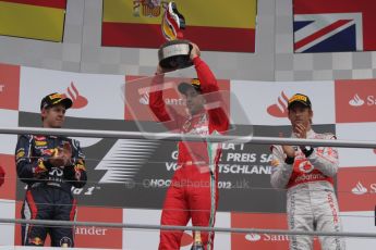 © 2012 Octane Photographic Ltd. German GP Hockenheim - Sunday 22nd July 2012 - F1 Podium - Fernando Alonso - Winner (Ferrari) alongside Sebastian Vettel, 2nd (Red Bull), and Jenson Button 3rd. Vettel was later dropped to 5th with a penalty for overtaking Button  (McLaren) off the track in the final laps. Digital Ref : 0421lw7d9252