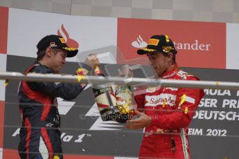 © 2012 Octane Photographic Ltd. German GP Hockenheim - Sunday 22nd July 2012 - F1 Podium - Fernando Alonso - Winner (Ferrari) celebrates with Sebastian Vettel, 2nd (Red Bull). Vettel was later dropped to 5th with a penalty for overtaking Button  (McLaren) off the track in the final laps. Digital Ref : 0421lw7d9444