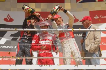 © 2012 Octane Photographic Ltd. German GP Hockenheim - Sunday 22nd July 2012 - F1 Podium - Fernando Alonso - Winner (Ferrari) being showered in champaign by Sebastian Vettel, 2nd (Red Bull), and Jenson Button 3rd. Vettel was later dropped to 5th with a penalty for overtaking Button (McLaren) off the track in the final laps. Digital Ref : 0421lw7d9466