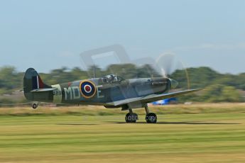 World © 2012 Octane Photographic Ltd. Goodwood Revival. September 15th 2012. Spitfire landing. Digital Ref : 0521cb1d9508