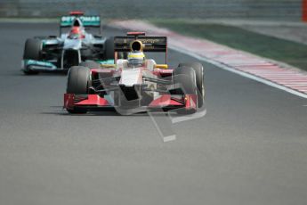 © 2012 Octane Photographic Ltd. Hungarian GP Hungaroring - Sunday 29th July 2012 - F1 Race. HRT F112 - Pedro de La Rosa about to be lapped by the Mercedes W03 of Michael Schumacher. Digital Ref :