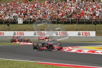 © 2012 Octane Photographic Ltd. Hungarian GP Hungaroring - Sunday 29th July 2012 - F1 Race. McLaren MP4/27 - Lewis Hamilton, Lotus E20 - Romain Grosjean and the other McLaren of Jenson Button. Digital Ref :