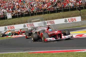 © 2012 Octane Photographic Ltd. Hungarian GP Hungaroring - Sunday 29th July 2012 - F1 Race. Ferrari F2012 - Fernando Alonso fends off Kimi Raikkonen's Lotus E20 and the rest of the pack. Digital Ref :