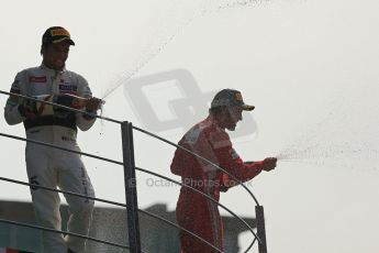 World © Octane Photographic Ltd. Formula 1 Italian GP, Podium ceremony 9th September 2012. Fernando Alondo sprays champaign to Ferrari's beloved Tiffosi next to Sergio Perez. Digital Ref : 0519lw1d9159