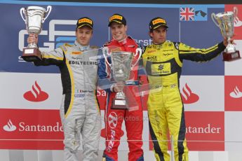 © 2012 Octane Photographic Ltd. British GP Silverstone - Sunday 8th July 2012 - GP2 Race 2 - Davide Valsecchi, Luiz Razia and Felipe Nasr rais their trophies on the podium. Digital Ref : 0401lw7d7674