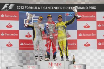 © 2012 Octane Photographic Ltd. British GP Silverstone - Sunday 8th July 2012 - GP2 Race 2 - Davide Valsecchi, Luiz Razia and Felipe Nasr rais their trophies on the podium. Digital Ref : 0401lw7d7682