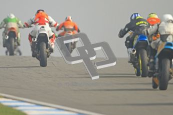© Octane Photographic Ltd. Thundersport – Donington Park - 24th March 2012. Bridgestone Thundersport 500, the pack heads away from the Melbourne hairpin. Digital ref : 0256cb7d2422