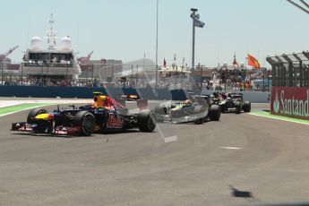 © 2012 Octane Photographic Ltd. European GP Valencia - Sunday 24th June 2012 - F1 Race. Mark Webber overtakes Heikki Kovalainen on lap 1. Digital Ref : 0374lw1d7003
