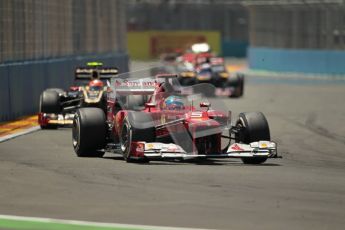 © 2012 Octane Photographic Ltd. European GP Valencia - Sunday 24th June 2012 - F1 Race. Ferrari F2012 - Fernando Alonso abing chased by Romain Grosjean's Lotus. Digital Ref : 0374lw1d7758