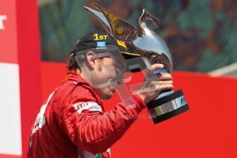 © 2012 Octane Photographic Ltd. European GP Valencia - Sunday 24th June 2012 - F1 Podium. Ferrari - Fernando Alonso raises his trophy in victory. Digital Ref : 0374lw1d7854