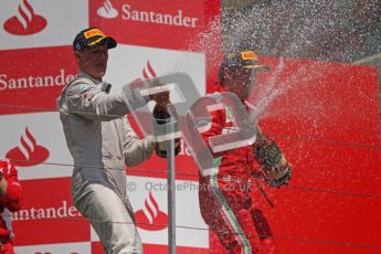 © 2012 Octane Photographic Ltd. European GP Valencia - Sunday 24th June 2012 - F1 Podium. Ferrari - Fernando Alonso and Michael Schumacher celebrate. Digital Ref : 0374lw7d3601