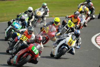 © Octane Photographic Ltd. Wirral 100, 28th April 2012. 250ccGP, Formula 400 and Minitwins, qualifying race. The pack heads into Cascades. Digital ref : 0303cb1d4560