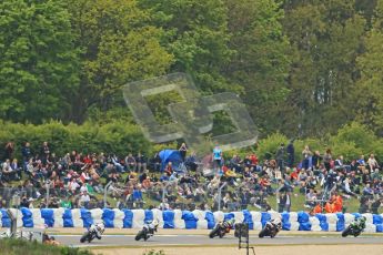 © Octane Photographic Ltd 2012. World Superbike Championship – European GP – Donington Park, Sunday 13th May 2012. Race 1. The pack heads through Hollywood in front of the huge crowd. Digital Ref : 0335cb1d5039