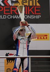 © Octane Photographic Ltd 2012. World Superbike Championship – European GP – Donington Park, Sunday 13th May 2012. Race 1 Podium. Marco Melandri lifts his winner's trophy. Digital Ref : 0335lw7d7541