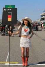 World © Octane Photographic Ltd. F1 USA GP, Austin, Texas, Circuit of the Americas (COTA), Sunday 17th November 2013 - Grid. Vettel's grid girl await the arrival of his car. Digital Ref : 0860lw1d5840