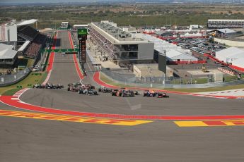 World © Octane Photographic Ltd. F1 USA GP, Austin, Texas, Circuit of the Americas (COTA), Sunday 17th November 2013 - Race. Sebastian Vettel in his Red Bull RB9 leads the pack into the 1st corner. Digital Ref : 0861lw1d5903