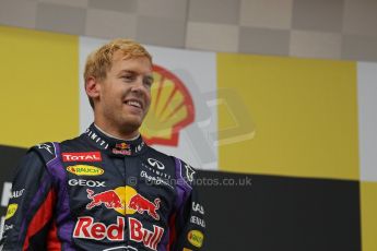 World © Octane Photographic Ltd. F1 Belgian GP - Spa-Francorchamps, Sunday 25th August 2013 - Podium. Infiniti Red Bull Racing RB9 - race winner Sebastian Vettel. Digital Ref : 0798lw1d0656