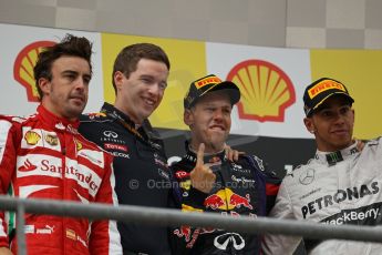 World © Octane Photographic Ltd. F1 Belgian GP - Spa-Francorchamps, Sunday 25th August 2013 - Podium. Infiniti Red Bull Racing RB9 - race winner Sebastian Vettel, Scuderia Ferrari F138 - Fernando Alonso (2nd) . and Mercedes AMG Petronas F1 W04 – Lewis Hamilton (3rd) on the podium. Digital Ref : 0798lw1d0828