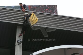 World © Octane Photographic Ltd. F1 Belgian GP - Spa-Francorchamps, Sunday 25th August 2013 - Podium. Anti Shell Arctic drill activists Greenpeace "Savethearctic.org" protesting on podium. Digital Ref : 0798lw1d0895