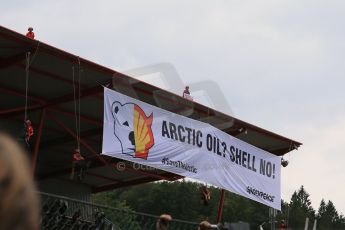 World © Octane Photographic Ltd. F1 Belgian GP - Spa-Francorchamps, Sunday 25th August 2013 - Podium. Anti Shell Arctic drill activists Greenpeace "Savethearctic.org" protesting on the main grandstand. Digital Ref : 0798lw1d1000