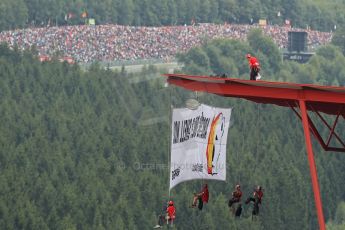 World © Octane Photographic Ltd. F1 Belgian GP - Spa-Francorchamps, Sunday 25th August 2013 - Podium. Anti Shell Arctic drill activists Greenpeace "Savethearctic.org" protesting during the race from the main straight grandstand. Digital Ref :