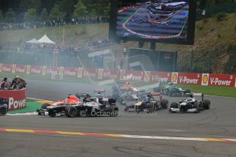 World © Octane Photographic Ltd. F1 Belgian GP - Spa-Francorchamps, Sunday 25th August 2013 - Race. The backmarkers headed by Pastor Maldonado (Williams) safely clear turn 1 on the opening lap. Digital Ref : 0797lw1d0736