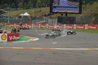 World © Octane Photographic Ltd. F1 Belgian GP - Spa-Francorchamps, Sunday 25th August 2013 - Race. Mercedes AMG Petronas F1 W04 - Nico Rosberg dives into La Source ahead of Jenson Button (Vodafone McLaren Mercedes) and Fernando Alonso (Scuderia Ferrari). Digital Ref : 0797lw1d0769