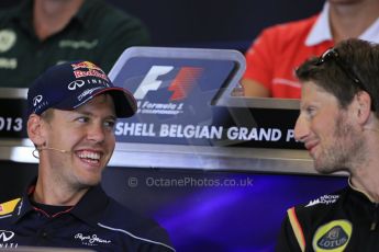 World © Octane Photographic Ltd. F1 Belgian GP - Spa - Francorchamps. Thursday 22nd August 2013. FIA Press Conference. nfiniti Red Bull Racing RB9 - Sebastian Vettel talking with Lotus F1 Team driver Romain Grosjean. Digital Ref : 0782lw1d6961