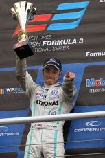 World © Octane Photographic Ltd. British Formula 3 – Brands Hatch. Saturday 10th August 2013 – Race 1. Race winner Jazeman Jaafar celebrates on the International Class podium – Carlin – Dallara F312 Volkswagen. Digital Ref : 0777lw7d1250