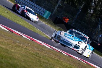 World © Octane Photographic Ltd./Chris Enion. Avon Tyres British GT Championship - Saturday 30th March 2013 Oulton Park – Practice 1. Porsche 997 GT3-R – Oman Air Motorbase – Michael Caine, Ahmad Al Harthy and McLaren MP4-12C GT3 – United Autosports – Mark Blundell, Roger Wills. . Digital Ref : 0604ce1d4825