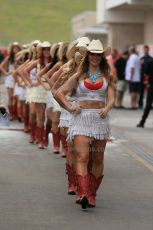 World © Octane Photographic Ltd. F1 USA GP, Austin, Texas, Circuit of the Americas (COTA), Sunday 17th November 2013 - Paddock. The grid girls form up in position in the paddock. Digital Ref : 0859lw1d5561