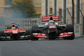 World © Octane Photographic Ltd. F1 Monaco GP, Monte Carlo - Saturday 25th May - Qualifying. Vodafone McLaren Mercedes MP4/28 - Sergio Perez and Marussia F1 Team MR02 - Jules Bianchi coming to a halt with an airbox fire. Digital Ref : 0708lw1d9724