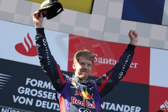 World © Octane Photographic Ltd. F1 German GP - Nurburgring. Sunday 7th July 2013 - Podium. Infiniti Red Bull Racing - Race Winner Sebastian Vettel. Digital Ref : 0750au8i0381