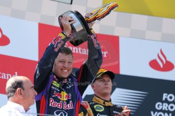 World © Octane Photographic Ltd. F1 German GP - Nurburgring. Sunday 7th July 2013 - Podium. Infiniti Red Bull Racing - Race Winner Sebastian Vettel's number 1 mechanic Joe Robinson hoists the winning constructor's trophey. Digital Ref : 0750au8i0432