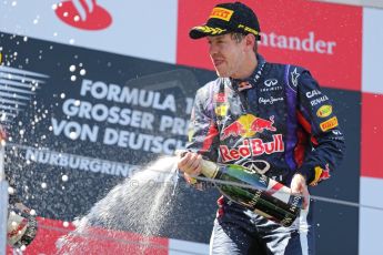 World © Octane Photographic Ltd. F1 German GP - Nurburgring. Sunday 7th July 2013 - Podium. Infiniti Red Bull Racing - Race Winner Sebastian Vettel celebrates. Digital Ref : 0750au8i0495