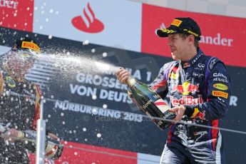 World © Octane Photographic Ltd. F1 German GP - Nurburgring. Sunday 7th July 2013 - Podium. Infiniti Red Bull Racing - Race Winner Sebastian Vettel celebrates. Digital Ref : 0750au8i0497