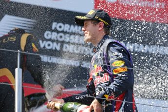 World © Octane Photographic Ltd. F1 German GP - Nurburgring. Sunday 7th July 2013 - Podium. Infiniti Red Bull Racing - Race Winner Sebastian Vettel celebrates. Digital Ref : 0750au8i0505