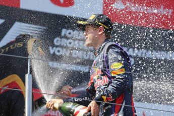 World © Octane Photographic Ltd. F1 German GP - Nurburgring. Sunday 7th July 2013 - Podium. Infiniti Red Bull Racing - Race Winner Sebastian Vettel celebrates. Digital Ref : 0750au8i0506