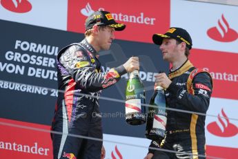 World © Octane Photographic Ltd. F1 German GP - Nurburgring. Sunday 7th July 2013 - Podium. Infiniti Red Bull Racing - Race Winner Sebastian Vettel and Lotus F1 Team's Romain Grosjean. Digital Ref : 0750au8i0595