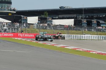 World © Octane Photographic Ltd. F1 German GP - Nurburgring. Sunday 7th July 2013 - Race. The Lotus F1 Team E21 of Kimi Raikkonen lines up the Mercedes AMG Petronas F1 W04 of Lewis Hamilton for a move up the inside. Digital Ref : 0749lw1dx9743